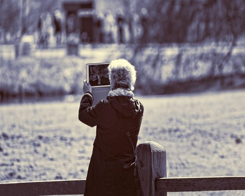 A person taking a break, looking away from their laptop